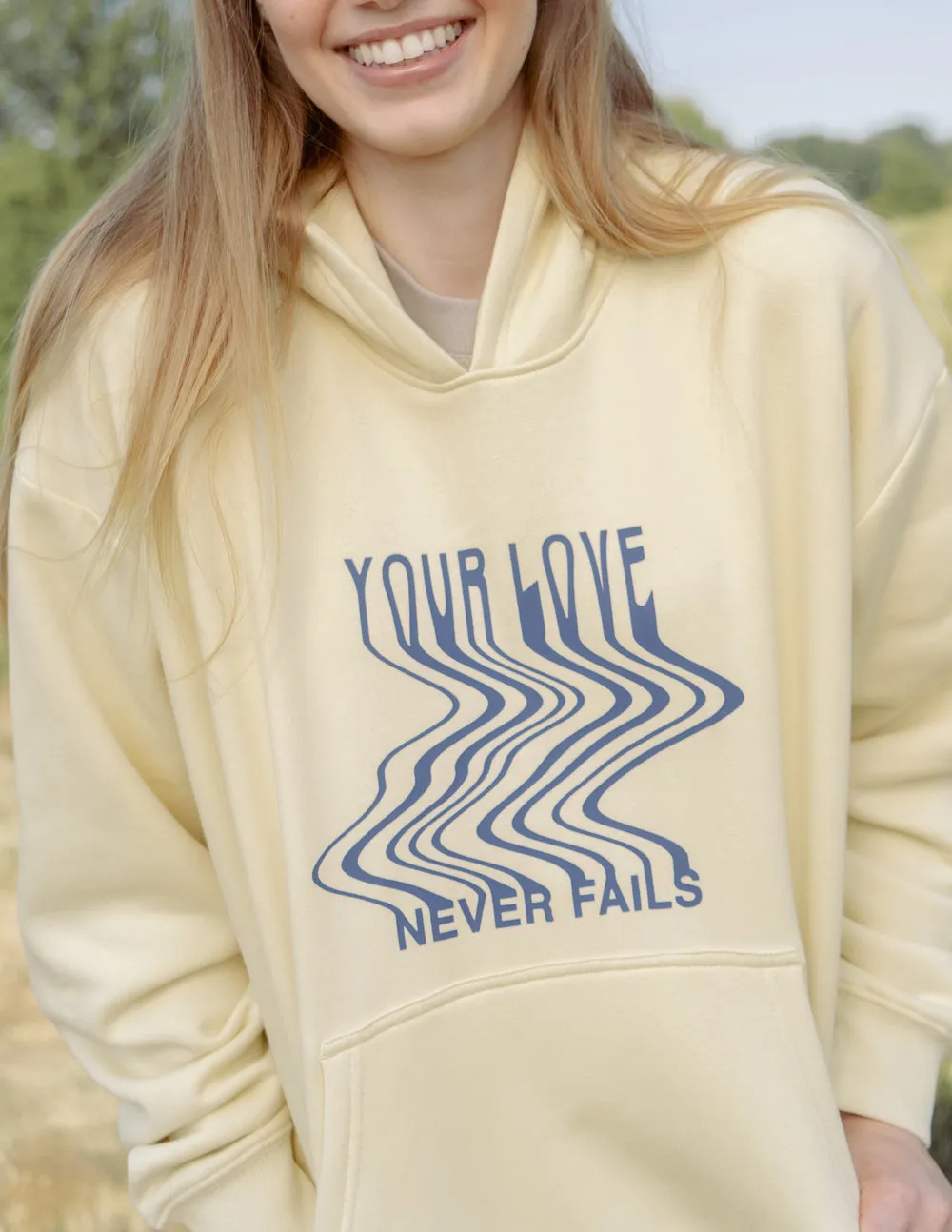 Love Never Fails Cream Unisex Hoodie